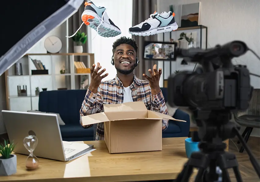 Filming a shoe demostration for an explainer video on a desk.