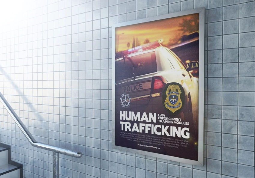 A poster for the Law Enforcement Training Modules film at a police station.