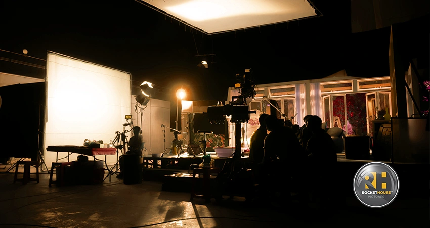 Wide shot of a producton studio full of crew members.
