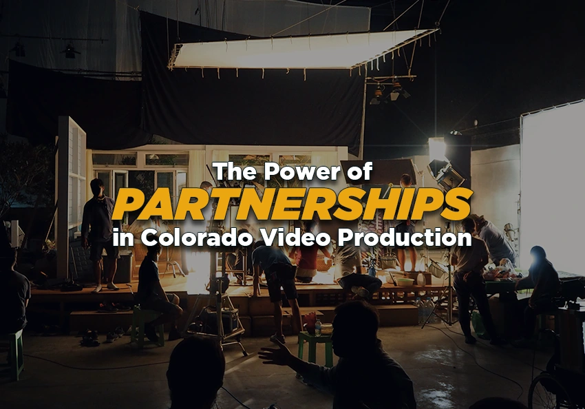 Wide shot of a producton studio full of crew members.
