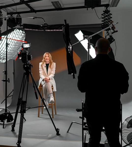 A cinematographer around several video cameras.