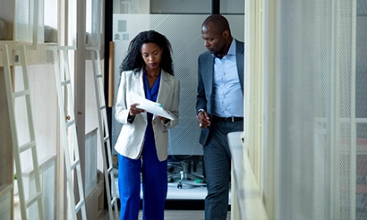 A cinematographer behind the camera on set